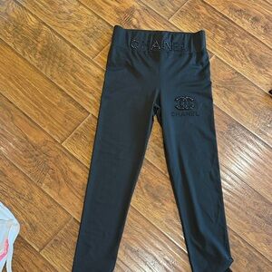 CHANEL Black Leggings with Logo Embellishment